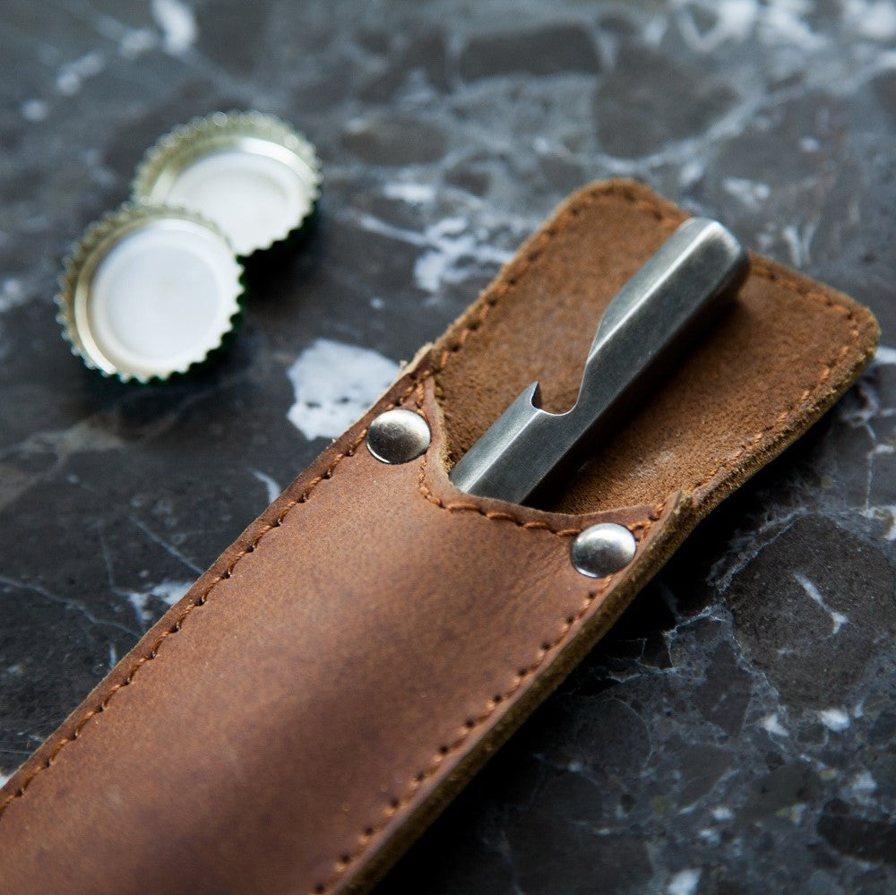 Bottle opener with leather sleeve